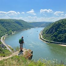 Hiker at a viewpoint on the Rheinsteig