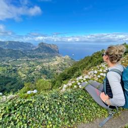 Hiker with a view of the north coast of Madeira