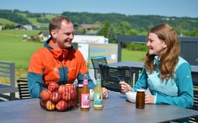 Eurofun employees at a table with fruit and yoghurt