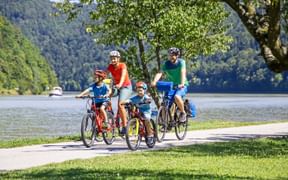 Family on the cycle path on the banks of the Danube