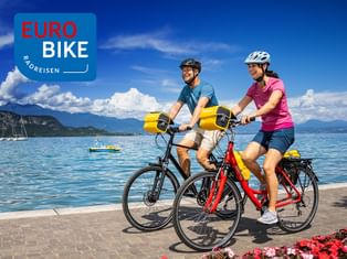 Two cyclists on the shores of Lake Garda in Bardolino