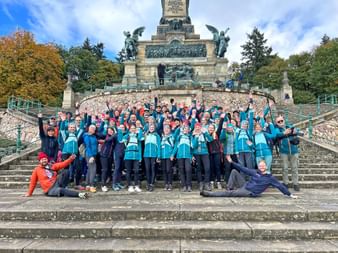 Group photo at the company trip in front of the Niederwald monument