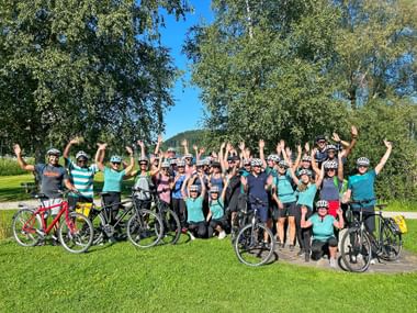 Group of cyclists on a meadow