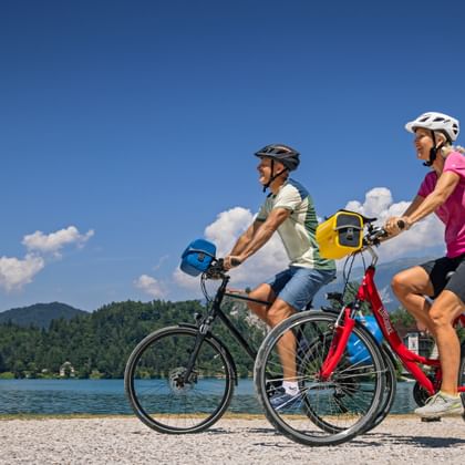 A couple's cycle tour on Lake Bled